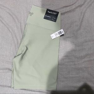 TNAGloss Atmosphere Bike Shorts 7 inch Green